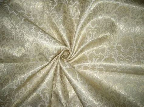 metallic fabric gold|metallic gold on cream fabric.